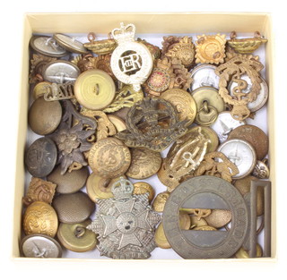 A quantity of Second World War and later cap badges and buttons 