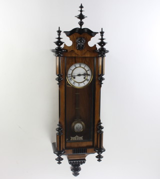 A striking Vienna style regulator with 13cm enamelled dial contained in a walnut case 