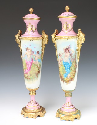 A pair of contemporary Sevres gilt metal mounted tapered vases decorated with a semi-clad lady and an angel in attendance the reverse with country scenes 51cm 