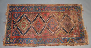 A Caucasian style blue, green and tan ground rug with 4 diamonds to the centre 214cm x 170cm 
