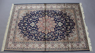 A blue and white floral patterned Belgian cotton Kashan style carpet with central medallion 230cm x 160cm 