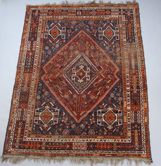 A blue and tan ground Persian Qashqai carpet with diamond medallion to the centre within multi row borders 297cm x 228cm, heavily worn  
