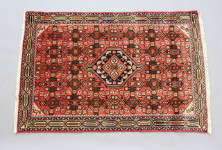 A pink and blue ground Persian Mehraban rug with multi row border 140cm x 95cm 
