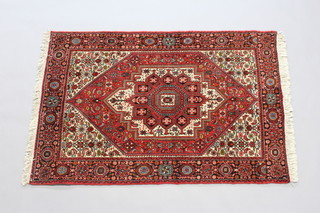 A red and white ground Bidjar rug with central diamond medallion 149cm x 100cm 