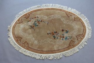 An oval brown ground and floral patterned Chinese rug 184cm x 128cm 
