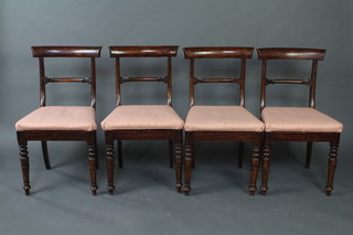 A set of 4 early Victorian simulated rosewood bar back dining chairs with shaped mid rails and upholstered drop in seats on turned supports 