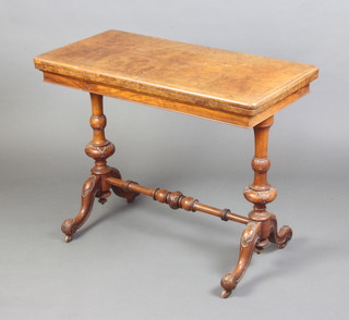 A Victorian rectangular figured walnut and quarter veneered card table raised on turned supports with H framed stretcher 75cm h x 94cm w x 47cm d  