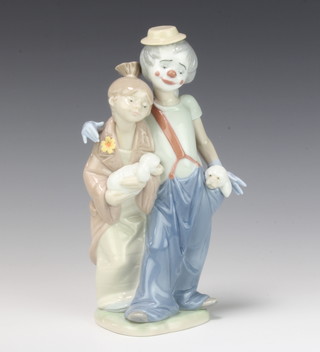 A Lladro Society 2000 figure of a clown and young lady both with puppies no.7686 22cm, boxed
