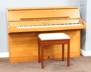 Bentley, an upright piano with check action, no. 149211, contained in a light teak case 98cm x 139cm x 52cm together with a piano stool 