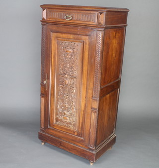 A 19th Century French carved oak cabinet, the upper section fitted a drawer above a cupboard with shelved interior enclosed by heavily carved panelled door 136cm h x 64cm w x 43cm d 
