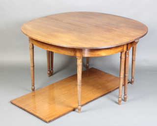 A George IV mahogany D end dining table with 1 extra leaf, raised on 8 turned supports, 70cm h x 122cm w, x 120cm l x 171 when extended  