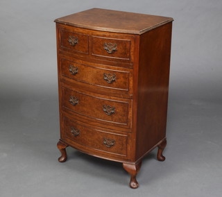 A Georgian style figured walnut bow front chest of 2 short and 3  long drawers with quarter veneered top, raised on cabriole supports 38cm x 48cm x 38cm 