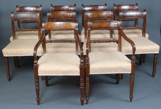 A harlequin set of 10 19th Century bar back dining chairs with rope mid rails and over stuffed seats raised on turned supports 