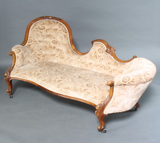 A Victorian carved walnut spoon back settee upholstered in sculptured brown Dralon 90cm h x  184cm w x 86cm d 