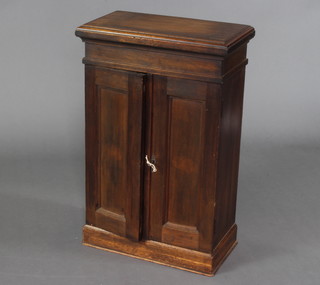 A cedar cigar cabinet, fitted shelves and labelled Carlos Questa Habana 74cm h x 48cm w x 25cm d 