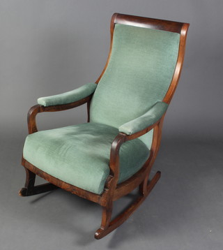 A William IV mahogany show frame rocking chair upholstered in blue material, both legs have old repairs 