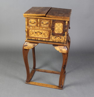 A Chinese marquetry inlaid table cabinet, having a cupboard to the side with 2 short drawers, flanked by 2 short and 1 long drawer, the base fitted a tray, raised on cabriole supports 86cm h x 45cm w x 35cm d  