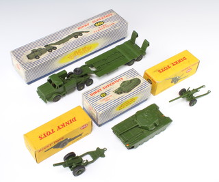 A Dinky Supertoys 651 Centurion tank boxed (slight tear to side of box), 660 tank transporter, 692 5.5 medium gun, ditto boxed, 693 7.2 Howitzer boxed (3/5 price on box and some damage to the side of the box) 