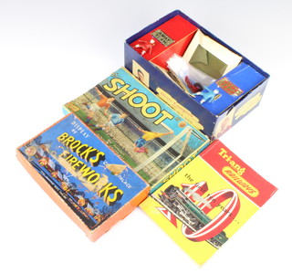 A 1950's football game "Shoot" complete with figures boxed (slight tear to side of box and 1 flap missing), a volume of "Triang Railways The First Ten Years" and an empty box for  Brocks  
fireworks 
 