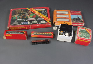 A Hornby 175 freight train set boxed together with an Mehanotehnika train set boxed, a Hornby 900 and a Hornby 902 controller and a small collection of rolling stock 
  