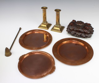 A pair of 19th Century brass candlesticks raised on square bases 16cm x 8cm x 8cm, 3 copper dishes by the Birmingham Guild Ltd 22cm x 24cm x 19cm together with a cast hardwood box in the form of a leaf 10cm x 17cm x 13cm and a brass candlestick