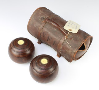 A pair of 1920's turned lignum vitae bowling woods - Royles Bowles no.249 complete with leather carrying case 