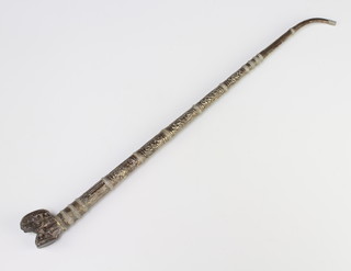 An embossed white metal opium pipe 45cm 