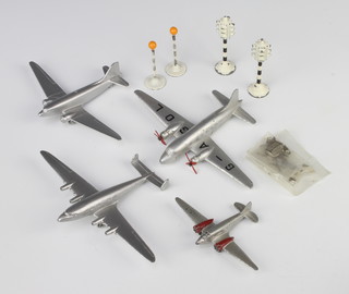 A Dinky Toys Meccano model of a four engine aircraft liner, ditto Viking, ditto Douglas, ditto light transport together with a pair of Dinky belisha beacons and a pair of traffic lights 