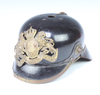 A First World War pickelhaube complete with badge 