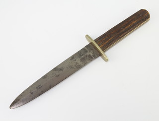 J Rogers and Sons, a First World War Bowie/fighting knife, the 17cm blade marked GR JG Rogers and Sons, 6 Norfolk Street, Sheffield, the reverse marked with an asterisk and a cross and having a horn grip together with a press clipping relating to Sergeant E Lane Military Cross  