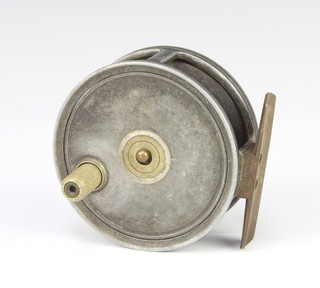 A 1920's 3" trout fishing reel with centre release latch 