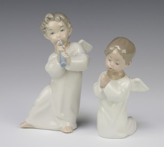 A Lladro figure of an angel playing a flute 16cm, a ditto in supplication 14cm 