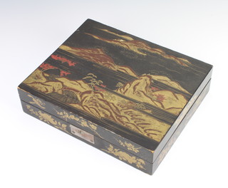 A Japanese lacquered box with hinged lid, the lid decorated a lake scene with mountains, the interior fitted a rectangular pail and 6 lidded boxes 7cm x 28cm x 23cm 