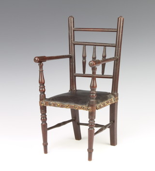 A Victorian mahogany dolls house stick and rail back open armchair 31cm x 16cm x 15cm (frame loose) 