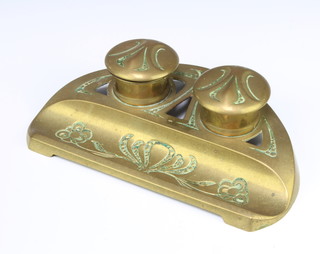 A pierced brass Continental Art Nouveau inkwell with hinged lid and pen recess, the base marked Ceschutze 5cm x 25cm x 15cm