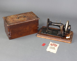 A Frister and Rossmann new improved silent cam action sewing machine no.581950327950, together with bill of sale dated 11/03/55 and 2 instructions books (folded and in fragile condition) 