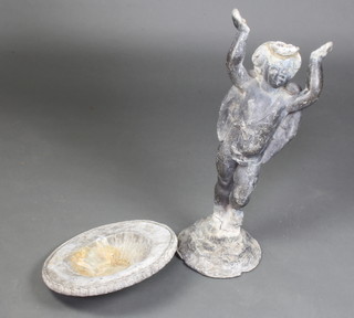 A 19th Century lead garden figure of a standing boy supporting a circular dish 72cm x 39cm