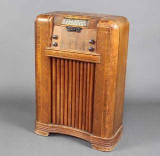 A Philco radio contained in an oak case 92cm x 65cm x 27cm 
