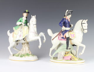 A pair of Continental figures of a lady and gentleman on horseback 27cm 