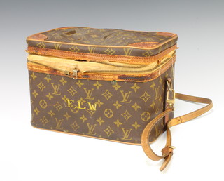 Louis Vuitton, a vintage rectangular vanity case with lid and shoulder strap 21cm x 30cm x 20cm 