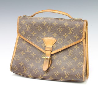 Louis Vuitton, a wedge shaped handbag, the interior marked Louis Vuitton Paris, Made in France 22cm x 28cm x 7cm 