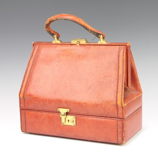 Fior, a lady's wedge shaped leather handbag the base incorporating a compartment, the interior marked Fior, Burlington Gardens, Mayfair, 25cm x 29cm x 15cm 
