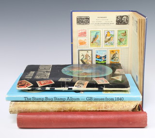 A Rapid album of mint and used stamps including New Zealand, Malaysia, Gibraltar, Canada, Australia, an album of Elizabeth II used stamps, a Stamp Bug album of Elizabeth II GB stamps, an All Nations album of world stamps, a stamp album (corners mouse chewed) and an Improved postage stamp album with new world stamps