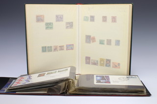An album of Elizabeth II GB first day covers, an album of Argentinian, Brazilian, Belgium, Chile, Italy, Germany mint and used stamps