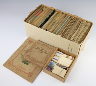 A John Players cigarette card album Military Uniforms of the British Empire and Overseas, 3 albums of Wills and Players cigarette cards, a small collection of loose tea cards and other tea cards