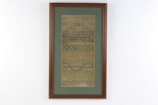 A 19th Century sampler of religious verse, flowers and scrolls 43cm x 20cm 

