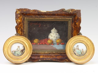 A 19th Century Continental oil on panel indistinctly signed, still life study, vase with fruits 7cm x 10cm together with 2 circular painted porcelain panels of ladies with animals 4cm 