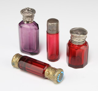 A Victorian cranberry glass scent bottle with silver lid Birmingham 1898 and 3 other mounted scent bottles
 