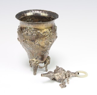 A 19th Century repousse cup decorated with flowers and scrolls, import marks London 1894, 11cm together with an Edwardian silver rattle teether Birmingham 1904 160 grams gross 