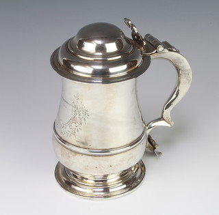 A good George III silver baluster tankard with S scroll handle and vacant cartouche, having a pierced thumb piece, London 1760, maker Thomas Whipham and Charles Wright, 892 grams, 20cm 